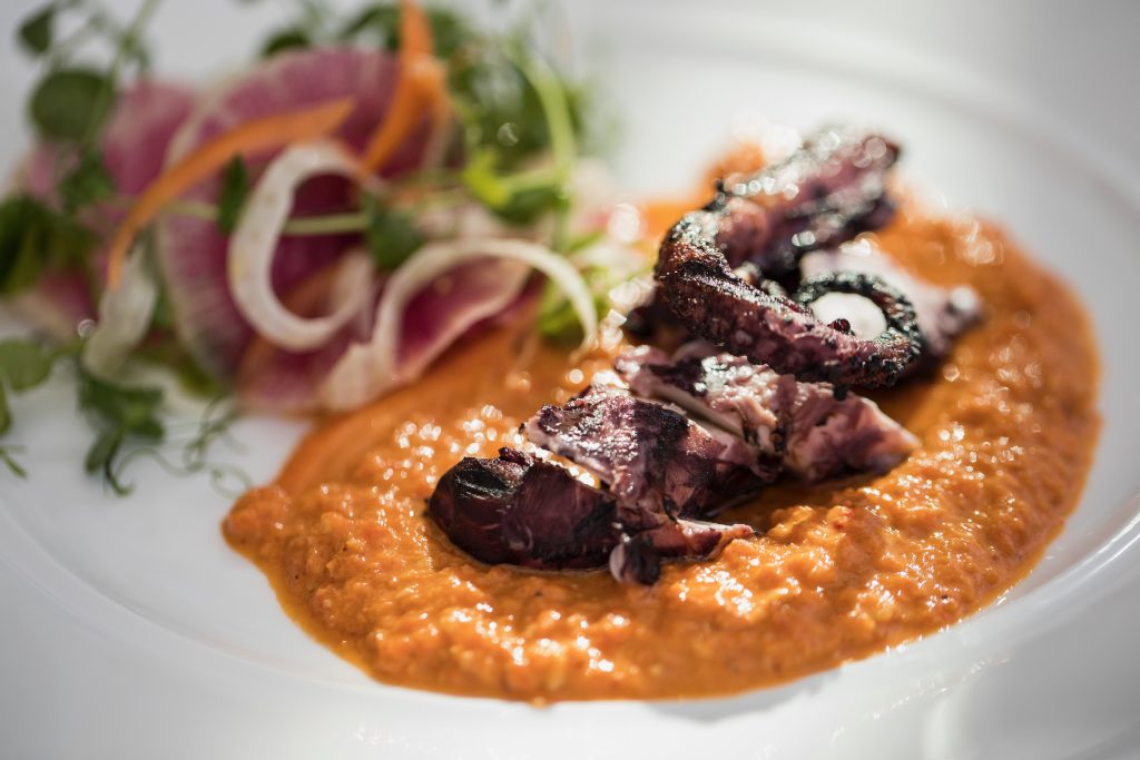 grilled spanish octopus with hazelnut romesco sauce